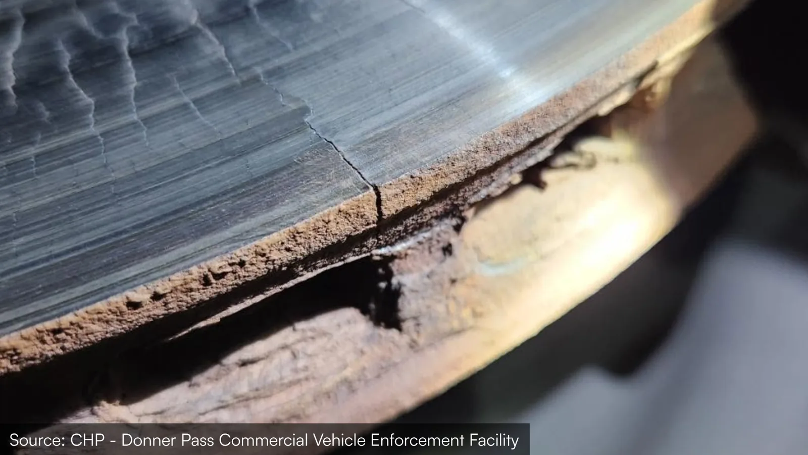 A cracked brake rotor showing heat checks across the friction surface