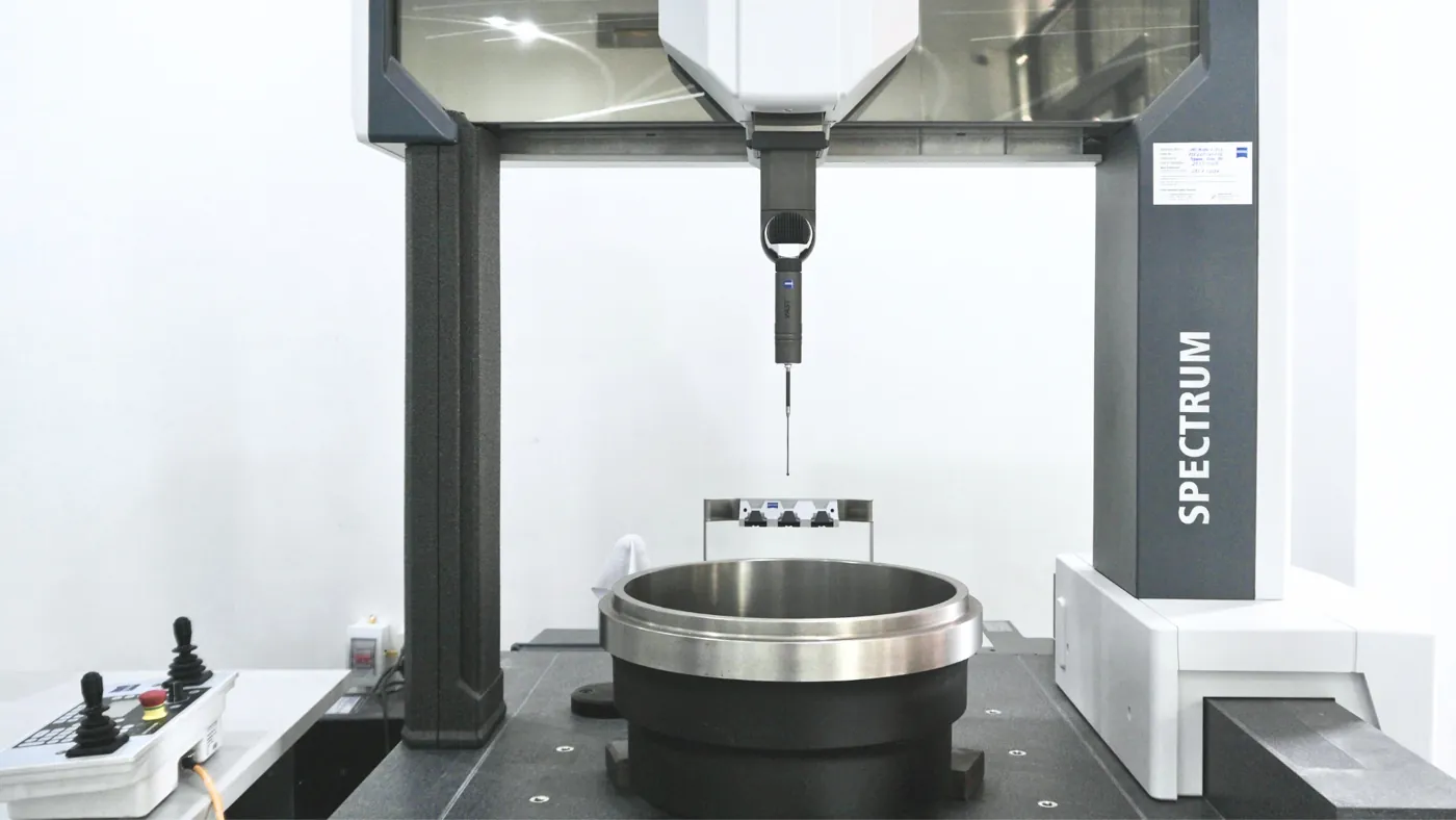 A machined brake drum on the ZEISS coordinate measuring machine in TBP Auto's testing lab