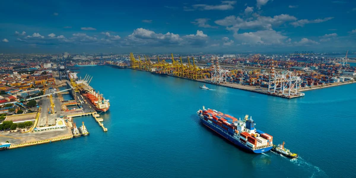 Aerial view of a container port with a loaded container ship departing — Vietnam-to-US brake drum export shipments