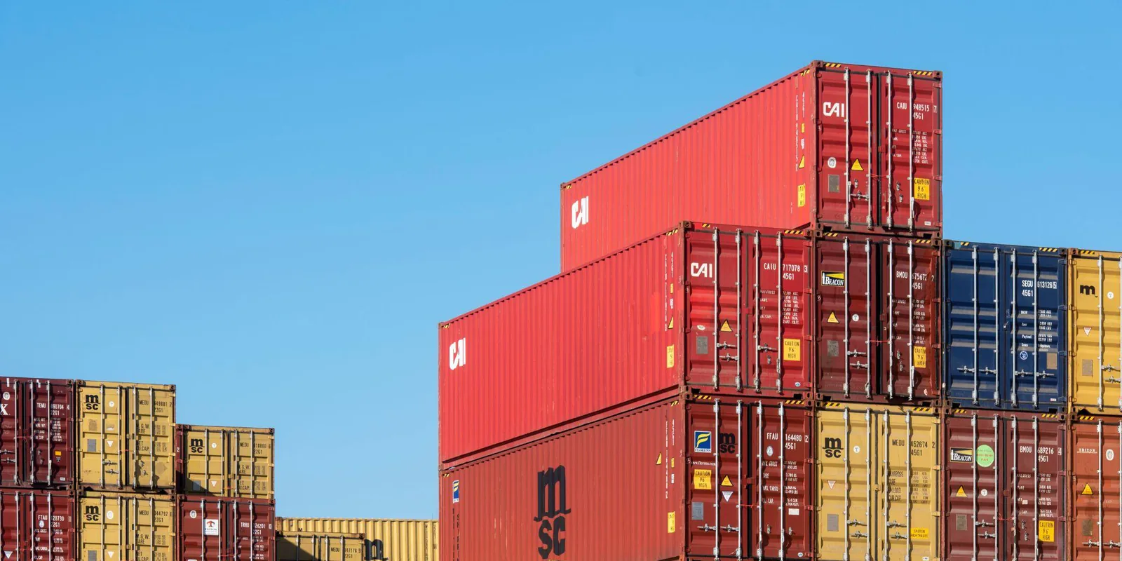 Stacked ocean containers at port — the U.S. import paperwork behind a Vietnam brake drum shipment